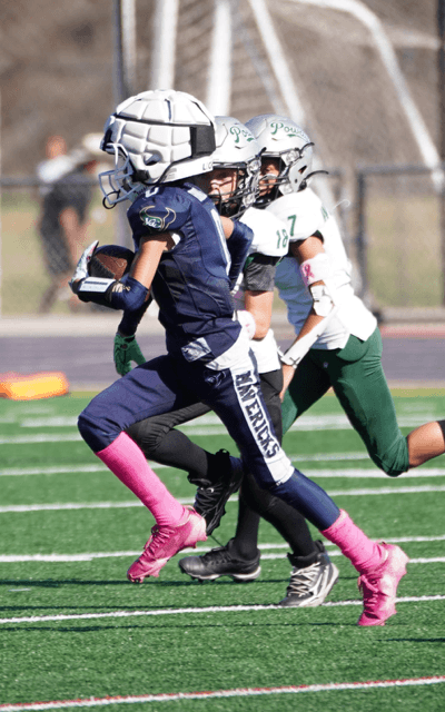 Ball carrier running past a defender