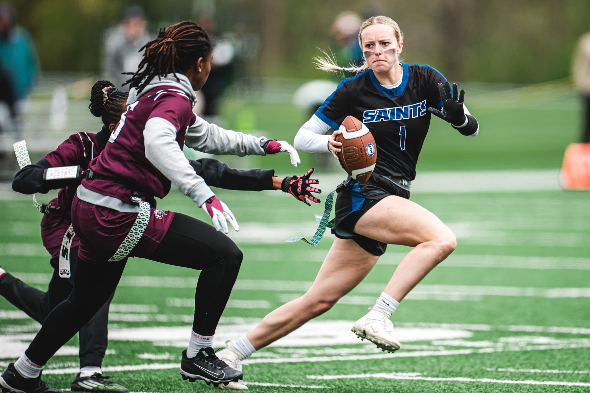 ECAC ball carrier evading a defender at the championships